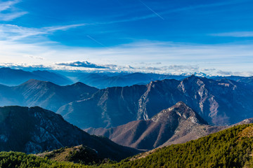 Beautiful captivating landscape of the layered misty hazy French Alps mountain range in...