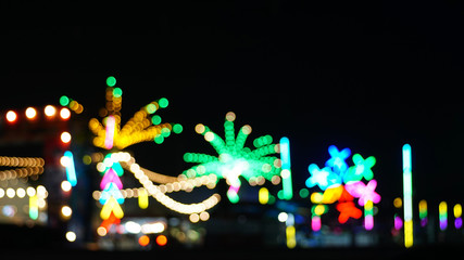 Colorful bokeh lights in the city. The city has a festival concept.