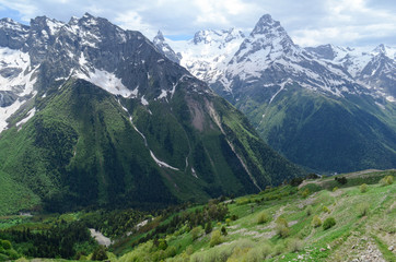 Fototapeta na wymiar Green valley of Dombay and mountains of the Caucasian ridge