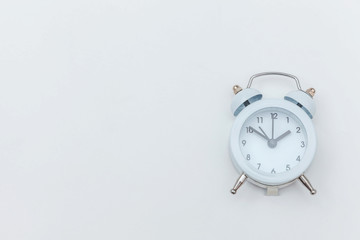 Simply flat lay design Ringing twin bell vintage classic alarm clock Isolated on white background. Rest hours time of life good morning night wake up awake concept. Flat lay top view copy space.
