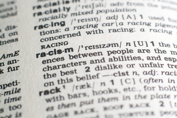 A close-up on a word Racism in English dictionary (selective focus)
