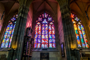 Colorful stained Glass Windows on the Windows of St. Vitus Cathedral in Prague. © toshket