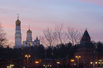 Fototapeta premium Kremlin tower and Ivan the Great bell tower after sunset. Fragment of architectural ensemble of the Moscow Kremlin.