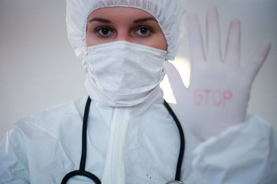 A young female doctor holds blood samples ready for analysis in the lab.-Image