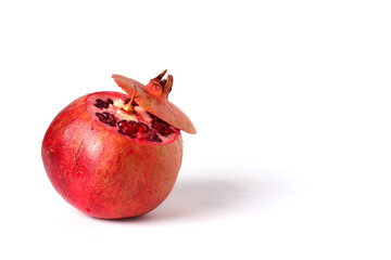Ripe pomegranate fruit isolated on white background cutout. Pomegranate seeds. Pieces of...