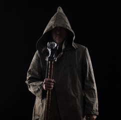 monk in the hood on a black background