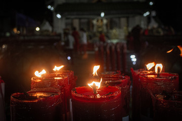 Red candles brightening at night