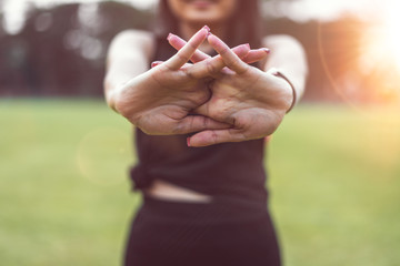 Women warm up before exercising outdoors during the morning hours in the park.