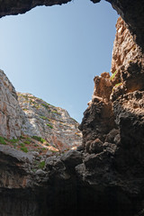 Fototapeta na wymiar A cave on the rocky coast of the island of Marettimo, in the Egadi Islands in Sicily, Italy.