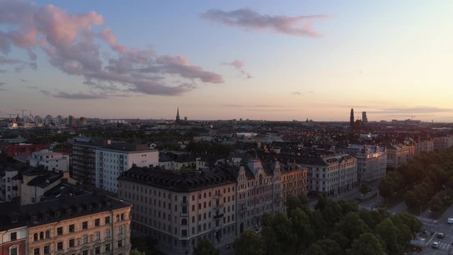 Aerial view of Stockholm cityscape skyline, &Ouml;stermalm district at sunset. Drone shot flying over Valhallav&auml;gen street and buildings. Beautiful sky over Capital city of Sweden