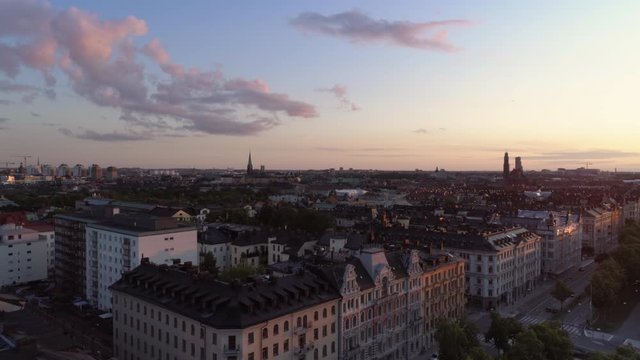 Aerial view of Stockholm cityscape skyline, &Ouml;stermalm district at sunset. Drone shot flying over Valhallav&auml;gen street and buildings. Beautiful sky over Capital city of Sweden