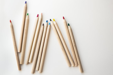 Wooden colorful ordinary pencils on a white background