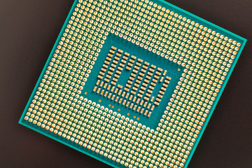 Processor microprocessor CPU of a desktop or laptop lies on a dark surface. Close-up. Electronic...