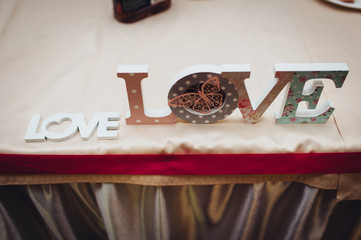 Wedding accessories and decorations made of plaster, foam letters for the holidays close-up....