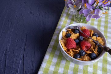 flowers and breakfast with crunchy muesli in a cup