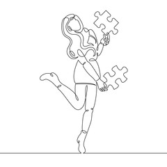 beautiful girl in a skirt holds in her hands an element of the puzzle.