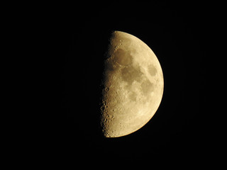 Half moon against a black sky