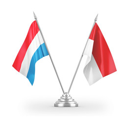 Indonesia and Luxembourg table flags isolated on white 3D rendering