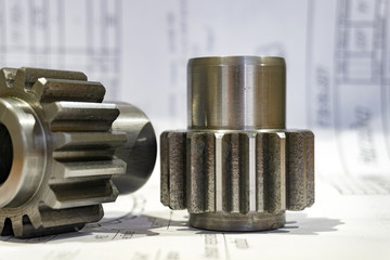 The gear after manufacturing on the gear cutter lies on the technical drawing.