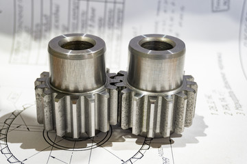 The gear after manufacturing on the gear cutter lies on the technical drawing.