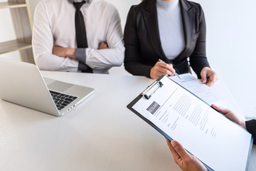 Business committee or interviewer consider and asking about profile of candidate, consider resume conducting a job and conversation listen to answers to thought attitude