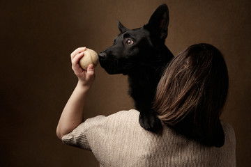 Black german shepherd Dog and with girl owner