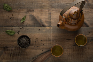 Tea concept. Teapot with tea on table. View from above with copy space.