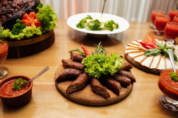 Table served for wedding banquet. Mixed food. Tasty appetizer. Catering service. Restaurant table with food. Huge amount of food on the table. Plates of food. Dinner time, lunch.