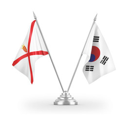 South Korea and Jersey table flags isolated on white 3D rendering