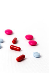 Assorted colorful pills and capsules in a Blister packaging