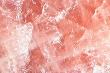 Isolated macro of large semi precious gemstone rose quartz showing matrix and texture 
