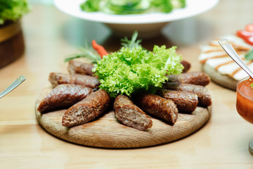 Food for corporate events, parties, conferences, holidays. Cold appetizers and salads on the wedding table. Plate with original appetizer on beautifully decorated table in the restaurant