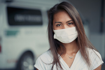 young beautiful Asian woman or hospital nurse using protective medical face mask in prevention vs virus infection. Coronavirus outbreak in China