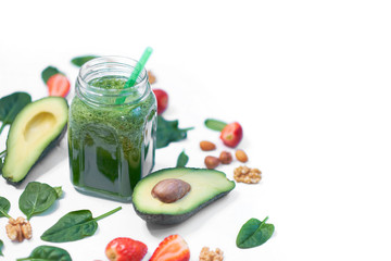 Healthy Vegan Green Spinach Smoothie. spinach and avocado on a white background top view. Close up of cooking in slow motion