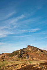 Epic Peak District Winter landscape of Ramsaw Rocks viewed from Hen Cloud with beautiful sunset sky