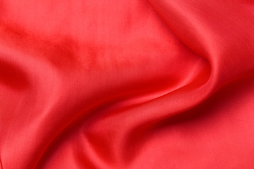 expensive fabric texture. abstract background with soft waves. Smooth elegant red silk or satin luxury cloth