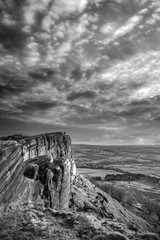 Epic Peak District black and white Winter landscape of view from top of Hen Cloud over countryside and towards Tittesworth Reservoir