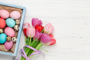 Easter greeting card with eggs and tulips