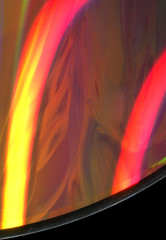 texture of a glossy multi-colored surface of a cd disk with damage