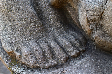 Female toes at the old statue