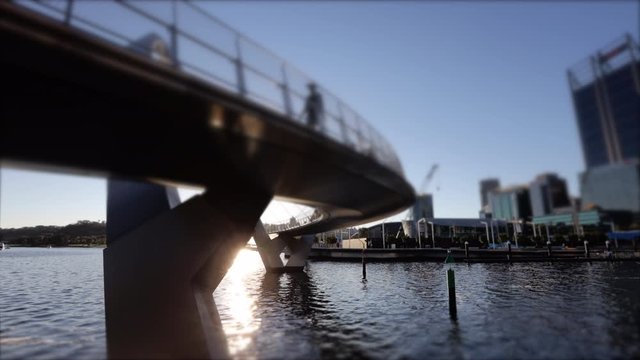 Stunning beautiful selective focused 4 K time lapse footage day to night sunset twilight taking from Elizabeth Quay Marina Bridge, Swan River cityscape of Perth city CBD, Australia     