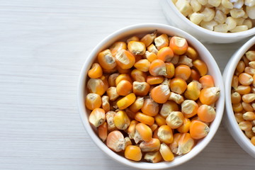 grains of natural corn in containers