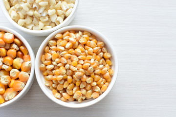 grains of natural corn in containers