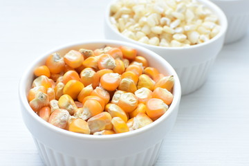 grains of natural corn in containers