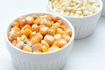grains of natural corn in containers