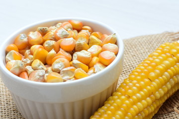 grains of natural corn in containers