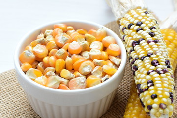 grains of natural corn in containers