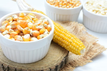 grains of natural corn in containers