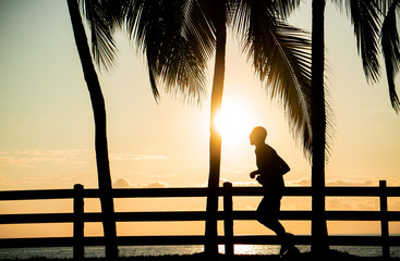 Jogger at the beach for sunset