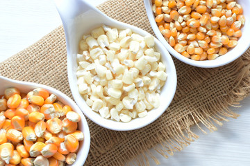 grains of natural corn in containers